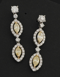 Appraisal: A pair of yellow and white diamond drop earrings Each