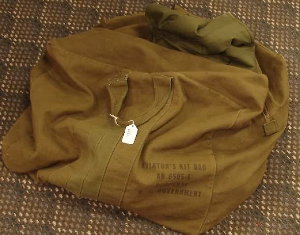 Appraisal: Grouping of clothing and aviator bag including fur- lined military