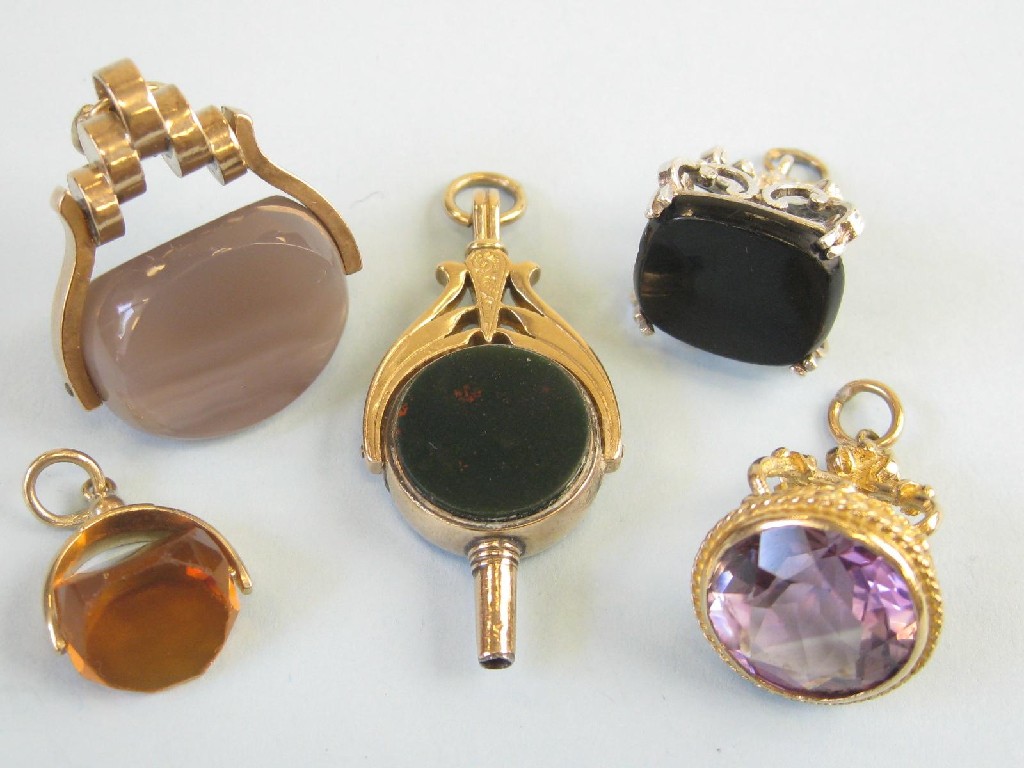 Appraisal: A collection of four various Fobs mounted stones and a