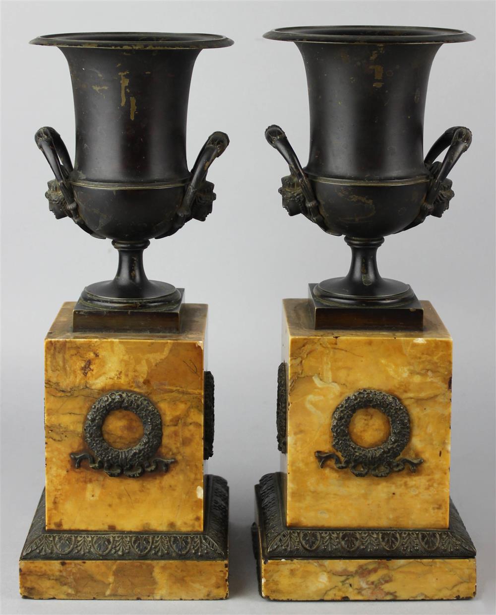 Appraisal: PAIR OF PARCEL GILT AND PATINATED METAL NEOCLASSICAL URNS late