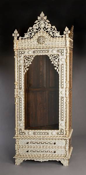 Appraisal: A Levantine shell inlaid hardwood vitrine cabinet The shaped cornice