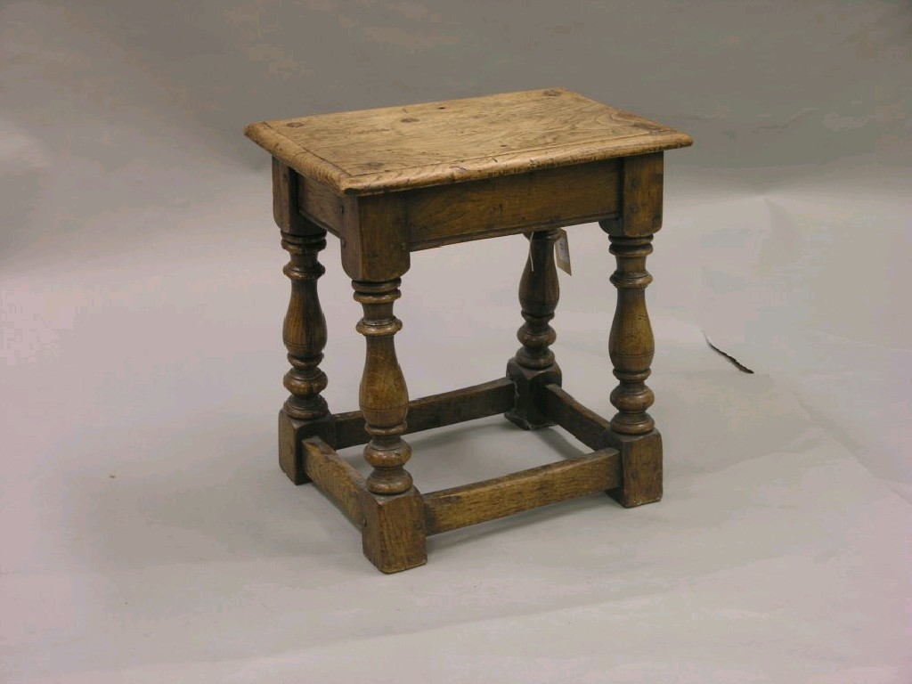 Appraisal: An early th century solid oak joint stool on baluster