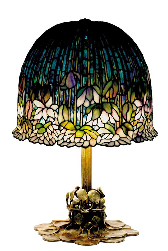 Appraisal: Tiffany style stained glass table lamp floriform stained glass shade