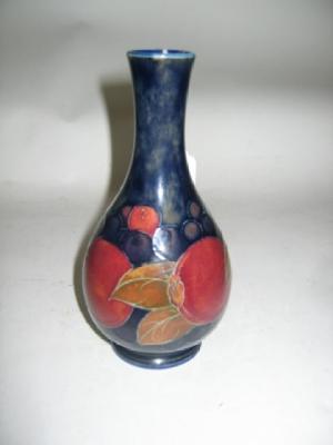 Appraisal: A MOORCROFT POTTERY VASE of bottle form tube lined in