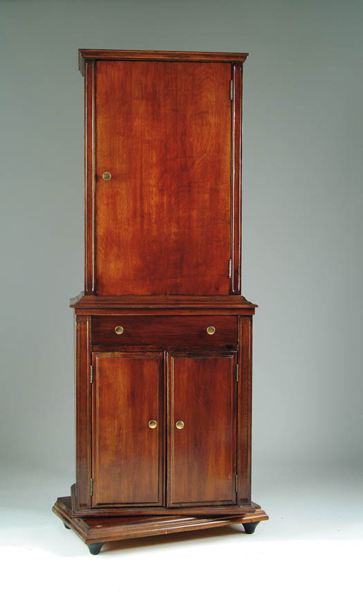 Appraisal: REVOLVING BILLIARD CABINET The cabinets top section has hinged door