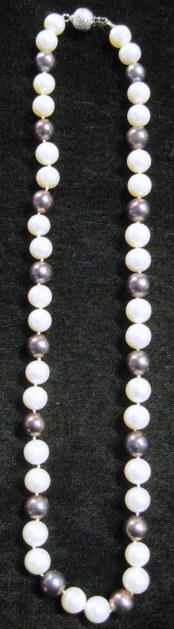 Appraisal: Lady's cultured pearl necklaceStrand accented by white and black pearls