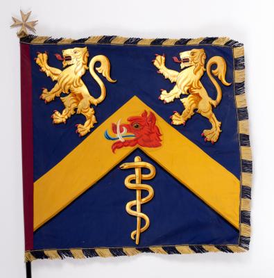 Appraisal: A flag bearing an armorial with fringed edges possibly for