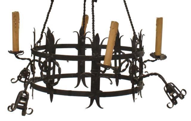 Appraisal: Gothic Revival wrought iron eight-light chandelier th c the four