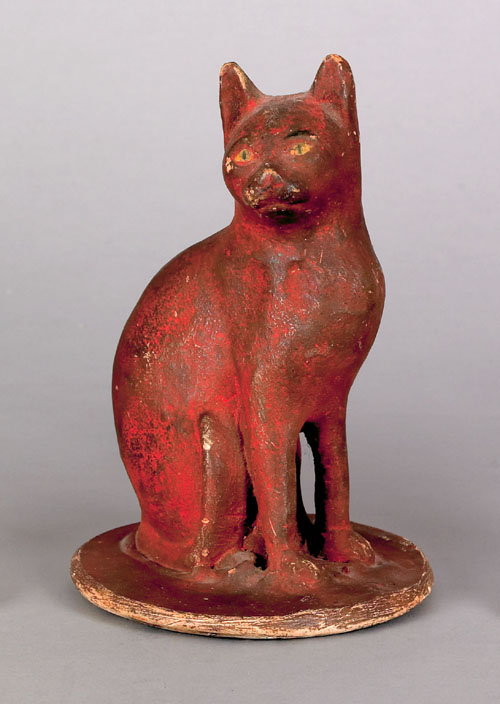 Appraisal: Chalkware seated cat late th c retaining its original red