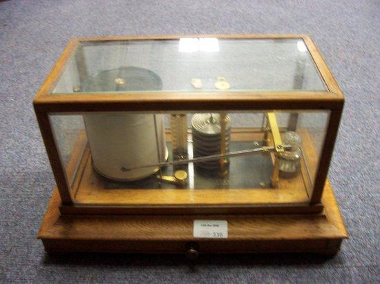 Appraisal: An oak cased barograph Ross London the bevelled glass top