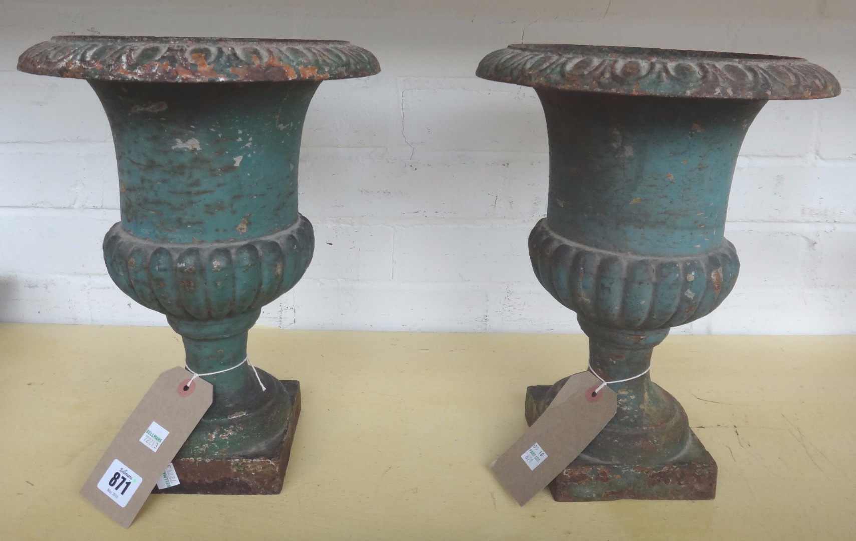 Appraisal: A pair of polychrome painted cast iron urns early th