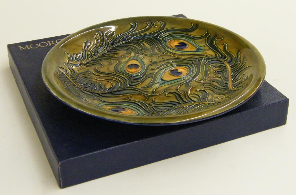 Appraisal: Moorcroft 'Peacock' circular plate decorated upon a mottled green ground