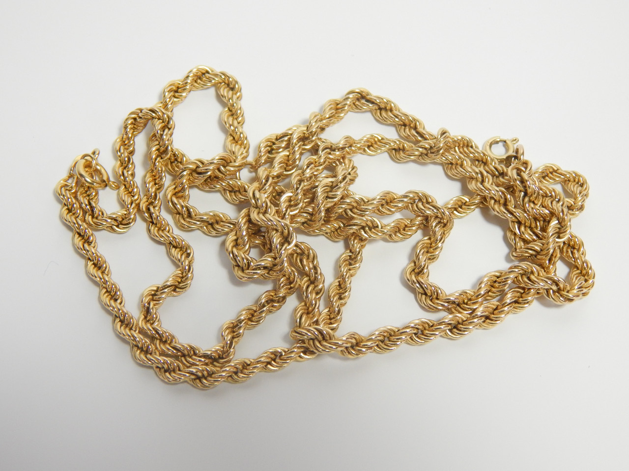 Appraisal: Two ct gold rope twist neck chains g