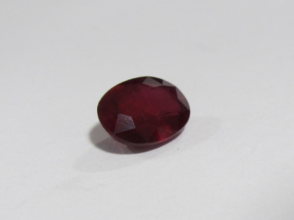 Appraisal: An unmounted oval cut ruby approximately carats