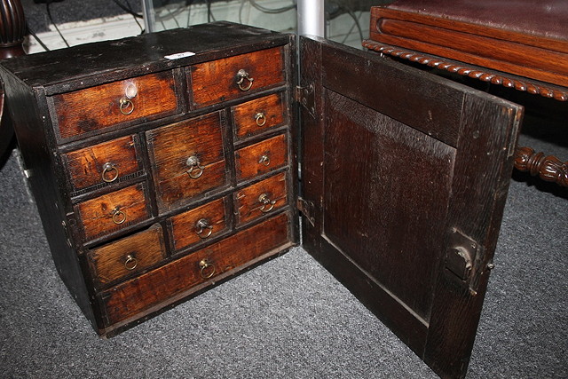 Appraisal: A GEORGIAN SMALL OAK WALL CABINET the interior fitted with