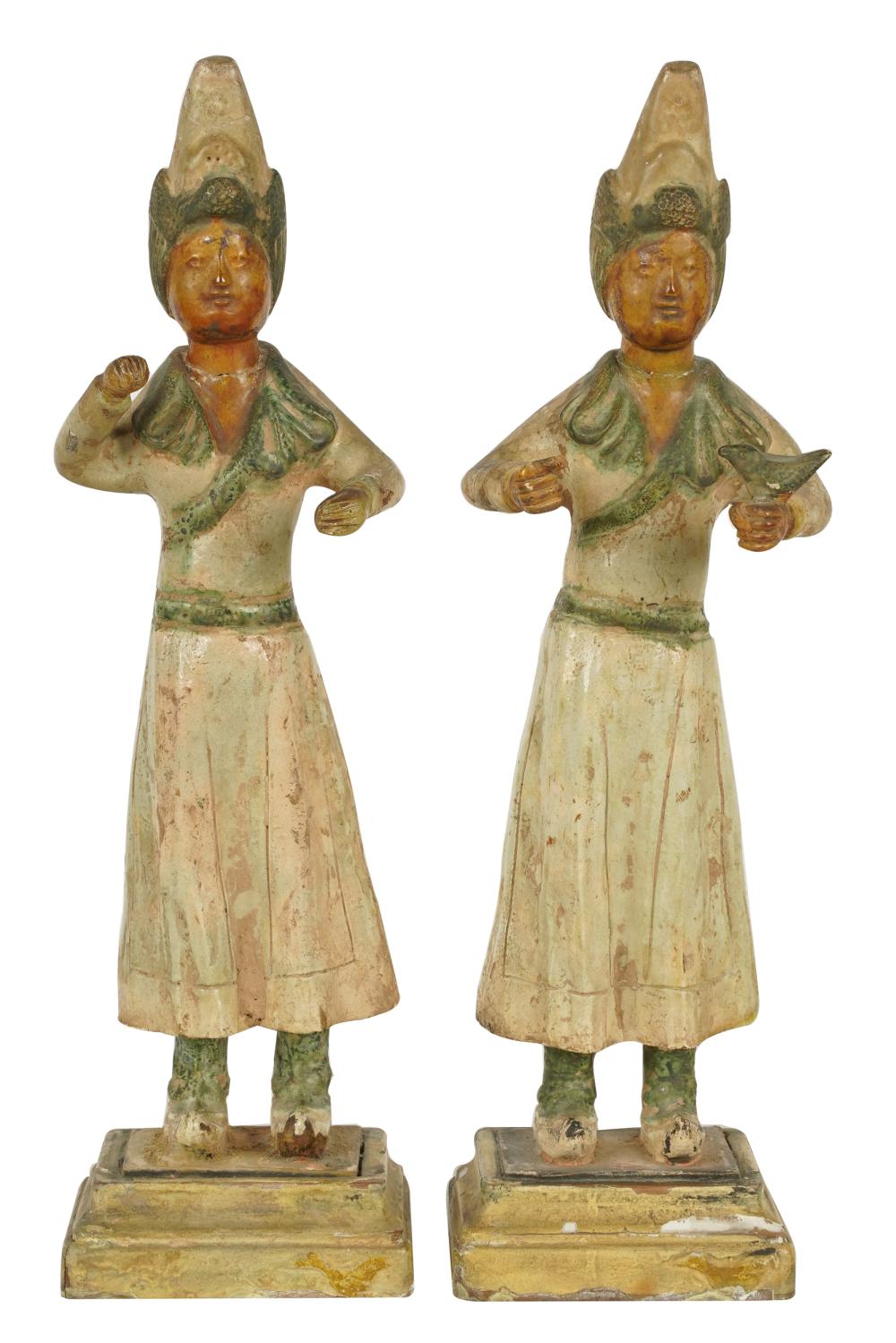 Appraisal: PAIR OF SOUTHEAST ASIAN GLAZED POTTERY ATTENDANTSeach standing on a