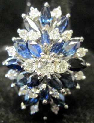 Appraisal: karat white gold diamond and sapphire ringEighteen marquise shape sapphires