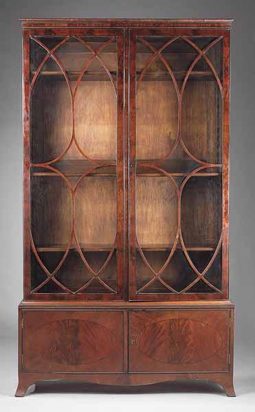 Appraisal: An Antique Georgian-Style Mahogany Bookcase the molded cornice above elliptical