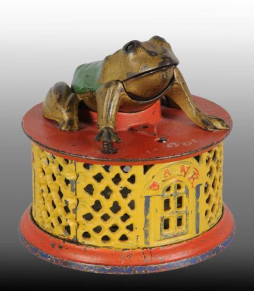 Appraisal: Cast Iron Frog on Round Base Mechanical Bank Description Manufactured