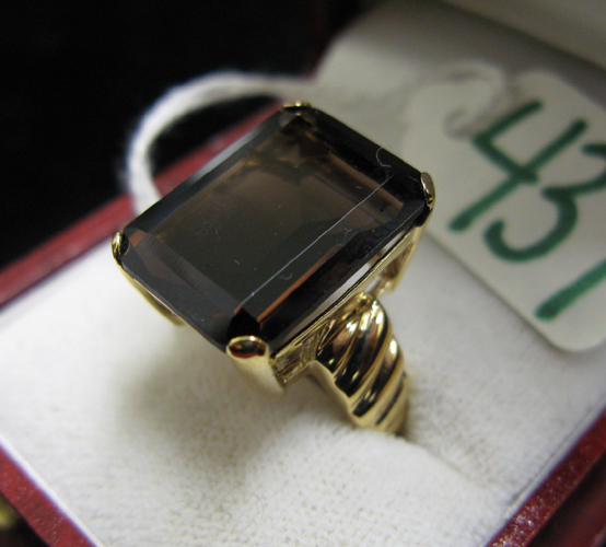 Appraisal: SMOKY QUARTZ AND FOURTEEN KARAT GOLD RING set with a