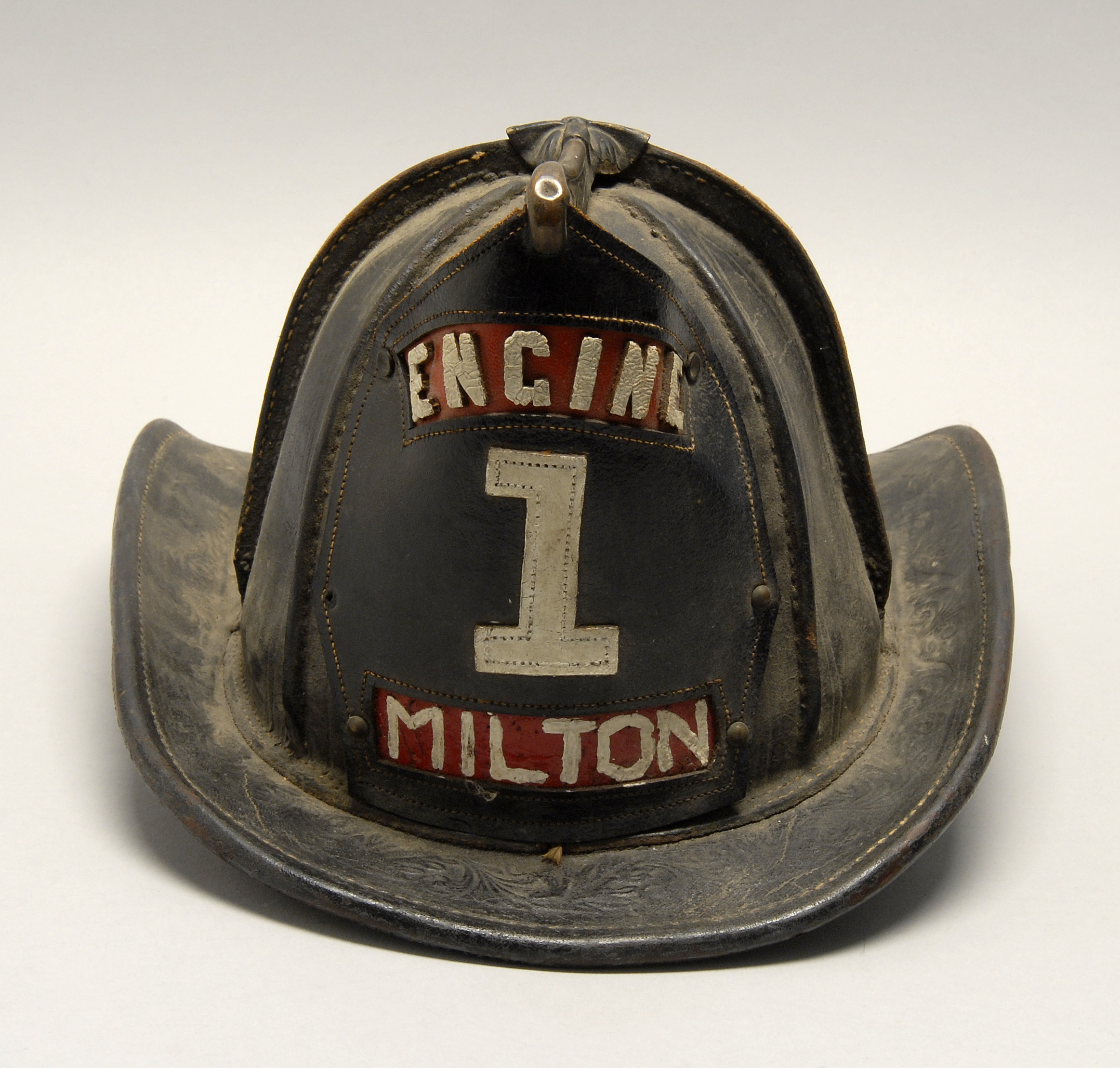 Appraisal: BRASS AND LEATHER FIRE HELMET Mid- th CenturyFrom the Milton