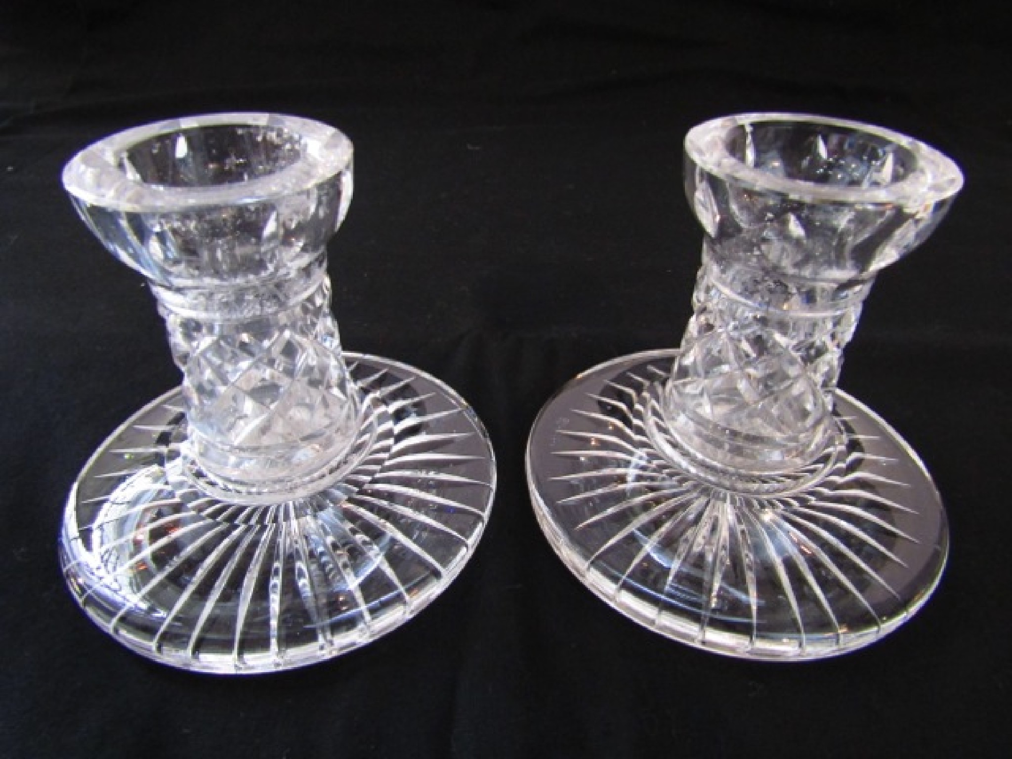 Appraisal: A pair of Waterford clear cut crystal candlesticks with star