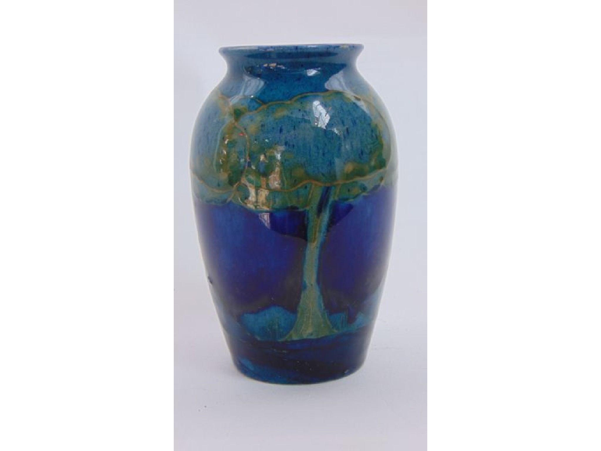 Appraisal: A Moorcroft Moonlit Blue vase of ovoid form with impressed