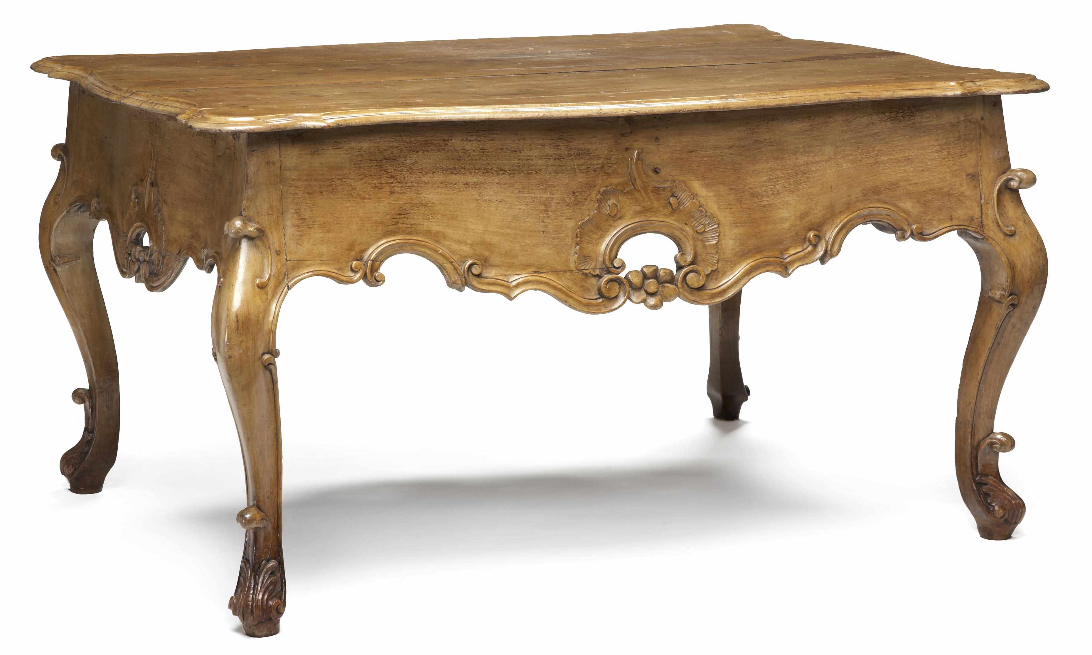 Appraisal: An imposing Continental Rococo carved walnut center table mid th