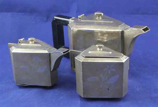 Appraisal: An Indian white metal three piece tea set of triangular