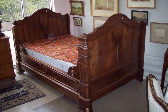 Appraisal: A bed with carved head and foot board