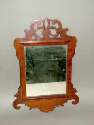 Appraisal: A Georgian style mahogany framed rectangular wall mirror with fret