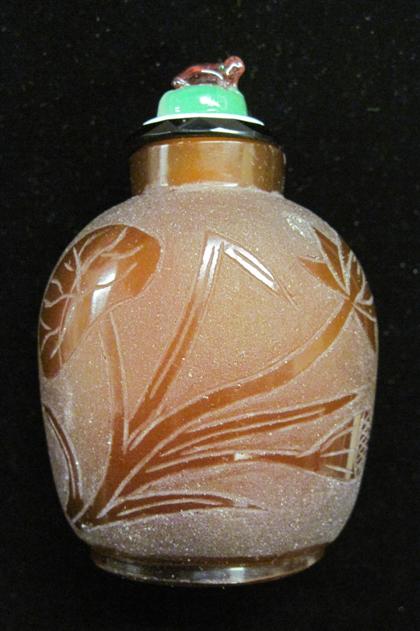 Appraisal: Chinese etched brown glass snuff bottleGlass stopper over wide bottle