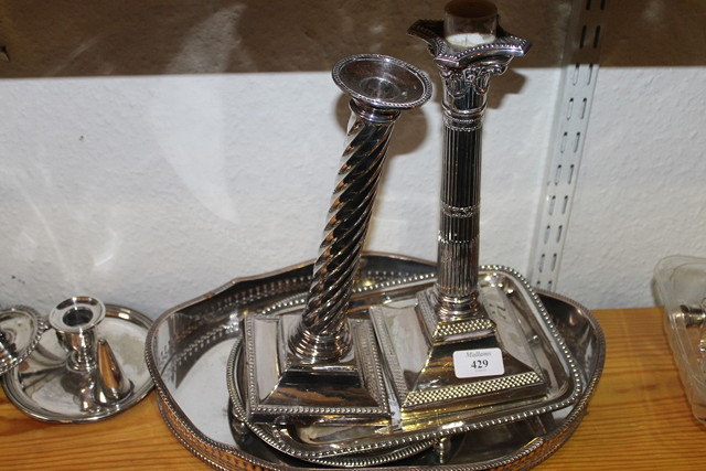 Appraisal: TWO SILVER PLATED COLUMN CANDLESTICKS three chamber sticks and a