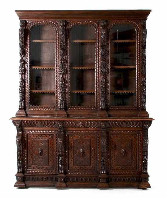 Appraisal: Renaissance Revival carved oak breakfront bookcase late th century top