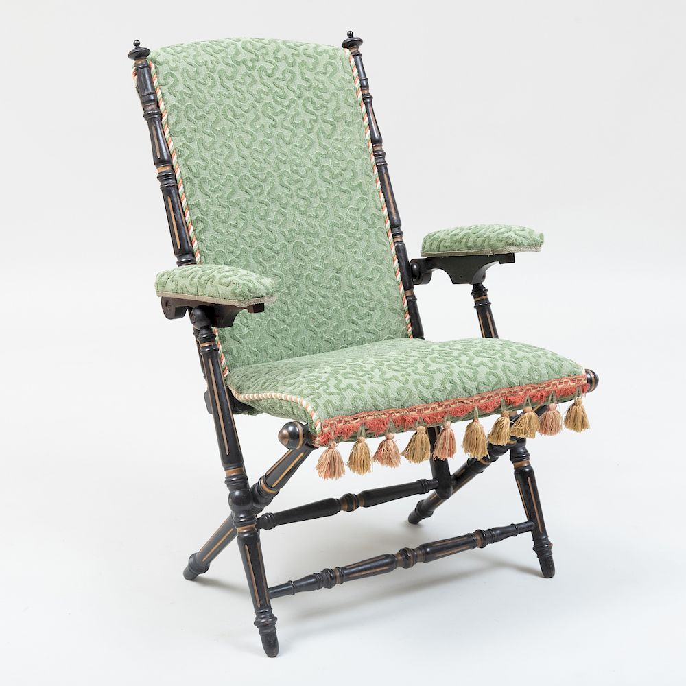 Appraisal: Hunzinger Ebonized and Parcel-Gilt Folding Chair Signed Upholstered in cut