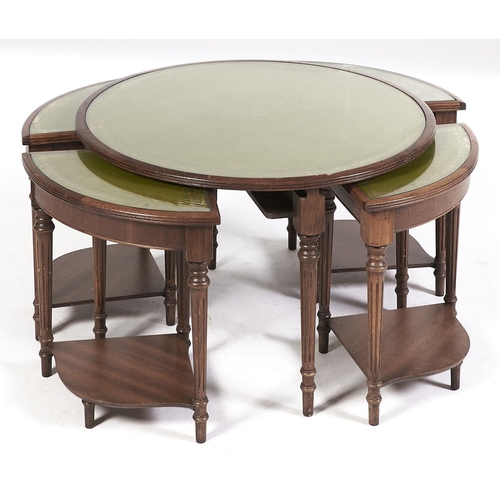 Appraisal: A round mahogany-stained nest of five tables with leather inlet