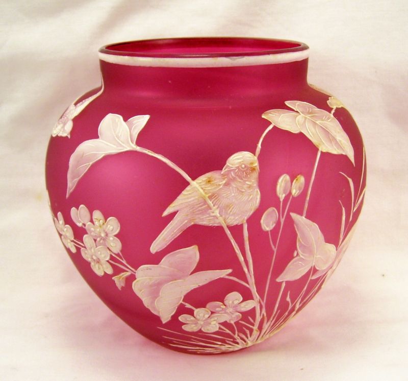 Appraisal: Cameo Cranberry Vase w enameling Satin cranberry glass vase attributed