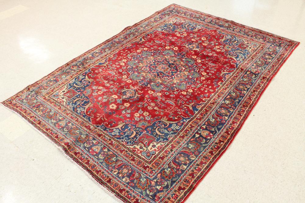 Appraisal: HAND KNOTTED PERSIAN CARPET floral and central floral medallion design