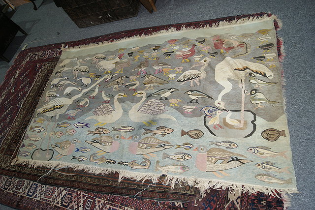 Appraisal: A FLAT WEAVE RUG decorated with birds and fishes x