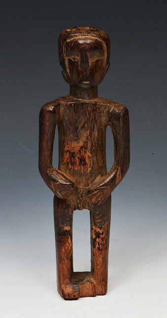 Appraisal: A CONGOLESE HARDWOOD CARVING of a standing male figure with