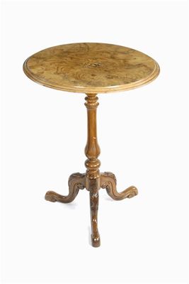 Appraisal: A Victorian walnut tripod table the circular veneered top with