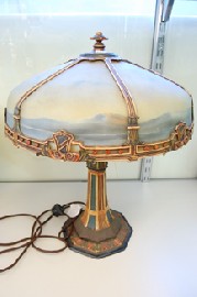 Appraisal: AN AMERICAN LAMP BASE WITH REVERSE HAND PAINTED GLASS SHADE