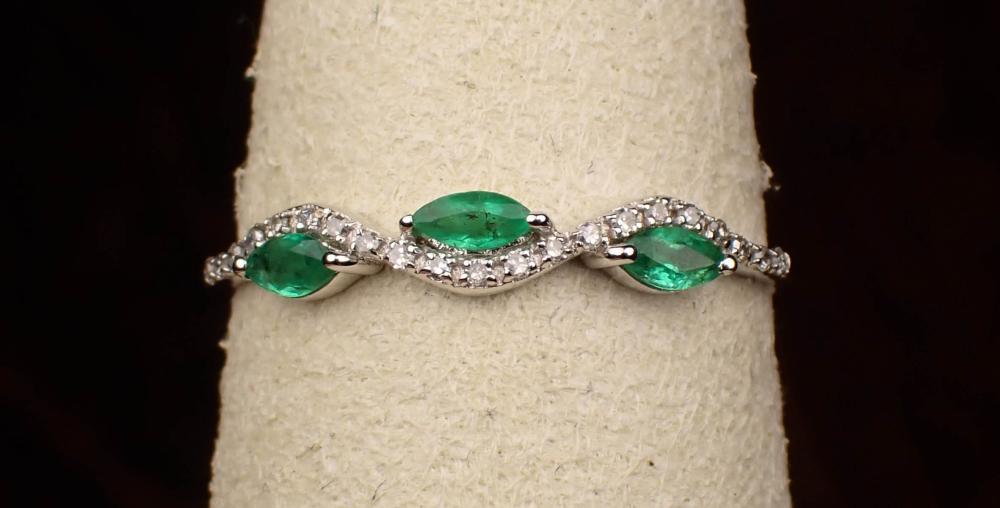 Appraisal: EMERALD DIAMOND AND FOURTEEN KARAT GOLD RING The white gold