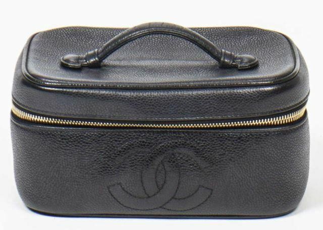 Appraisal: Chanel cosmetics pouch in black caviar leather flat handle at