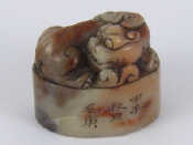 Appraisal: A finely carved hardstone oval seal with a temple lion