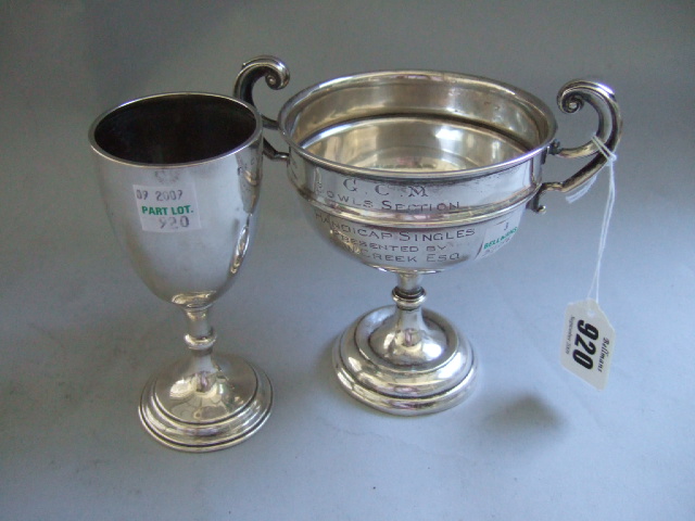 Appraisal: A silver trophy goblet London and a silver twin handled