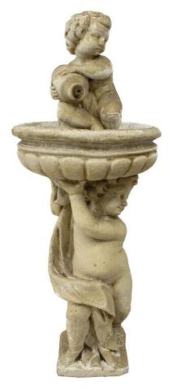 Appraisal: Italian cast concrete garden fountain th c putto figure holding