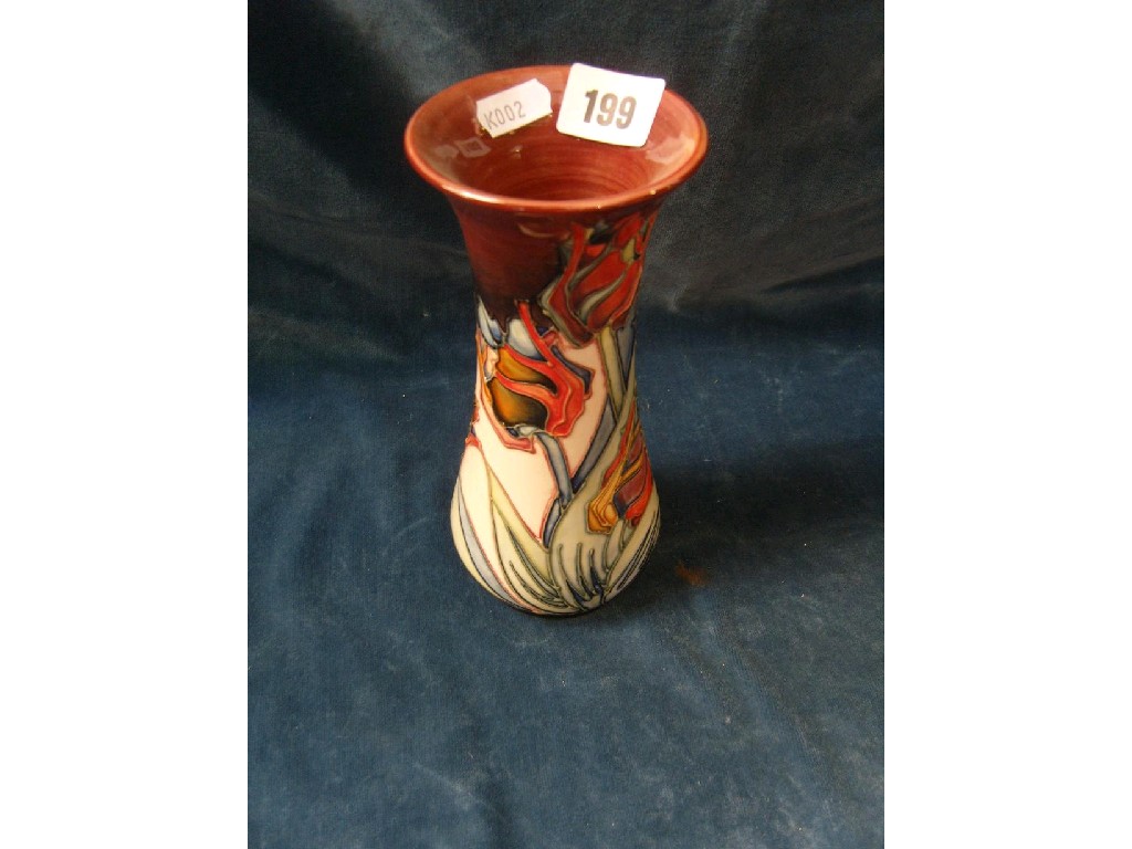 Appraisal: A Moorcroft vase of trumpet shape and stylised tulip design