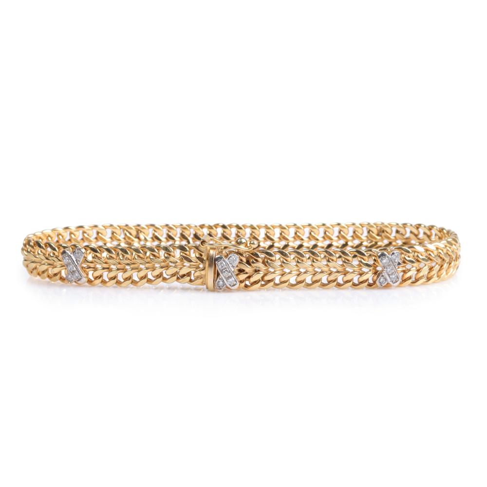 Appraisal: Italy K yellow and white gold double curb chain bracelet