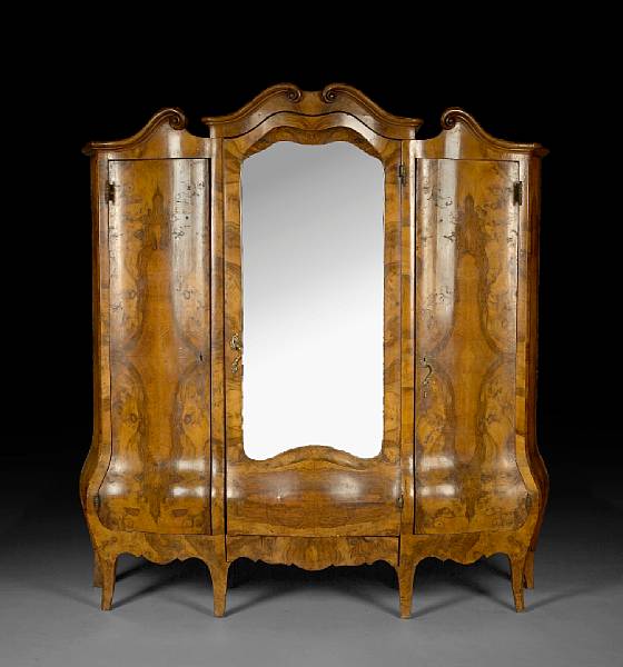 Appraisal: A German Baroque style burled walnut wardrobe early th century